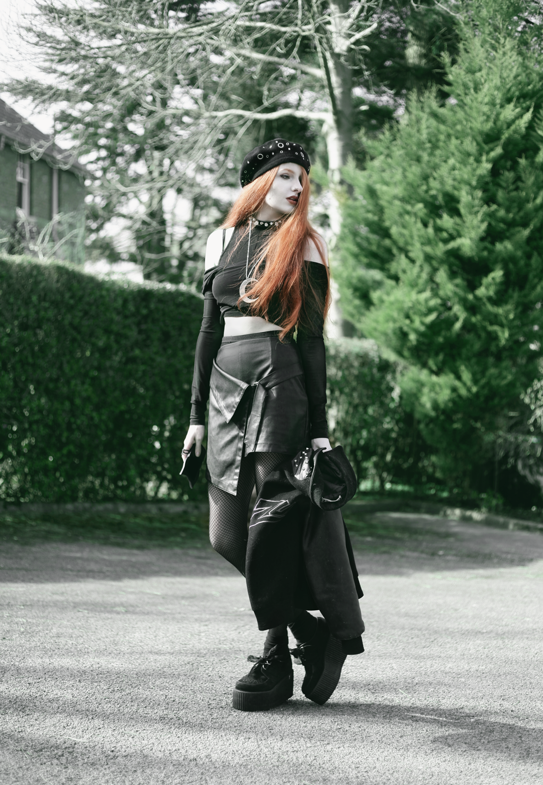 Olivia Emily wears Asos Eyelet beret, Killstar Luna Moon Necklace, Yayer high neck crop top under Asos Tall mesh off the shoulder wrap top, Vintage baseball jacket, asos faux leather wrap skirt & Underground triple sole creepers