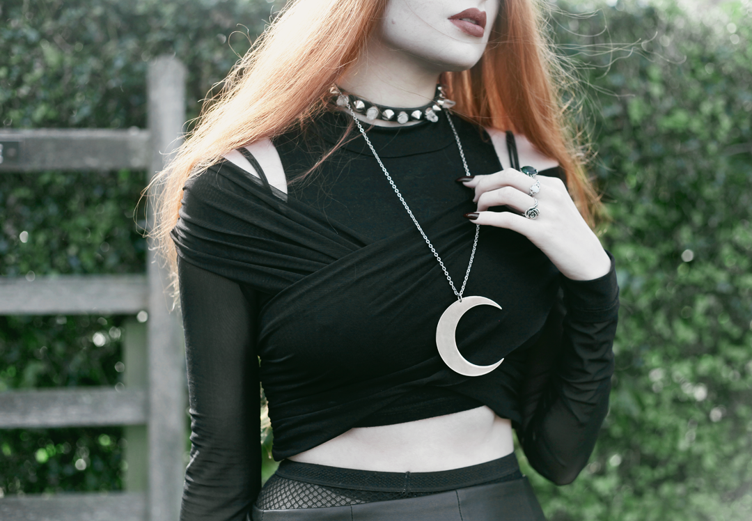 Olivia Emily wears Asos Eyelet beret, Killstar Luna Moon Necklace, Yayer high neck crop top under Asos Tall mesh off the shoulder wrap top, Vintage baseball jacket, asos faux leather wrap skirt & Underground triple sole creepers