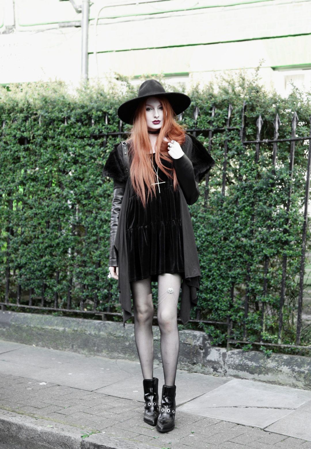 Olivia Emily wears Asos Reclaimed Vintage tiered black velvet dress, Killstar Witch Brim hat, Sanctus Asylum vegan suede coat, River Island leg chain, Asos eyelet boots