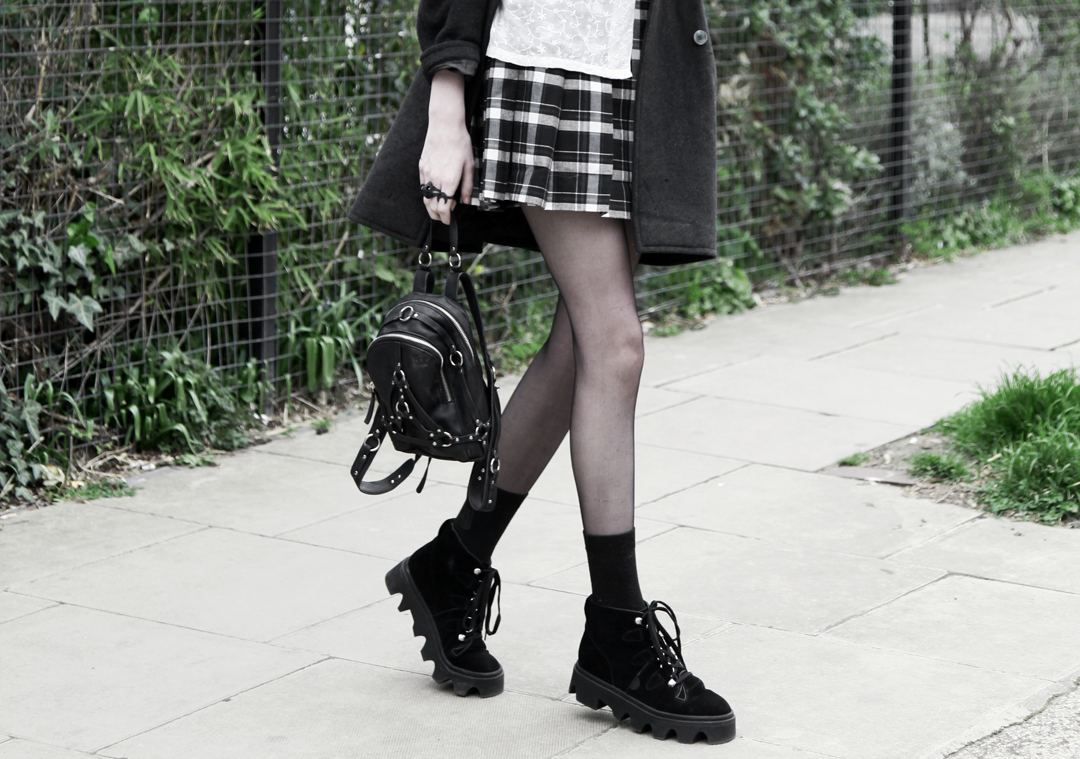 Olivia Emily wears Asos Eyelet Beret, Seconhand Coat & Blouse, Asos x Le Kilt collab plaid skirt, unif bound mini backpack, Underground Jungle Evolution Boots