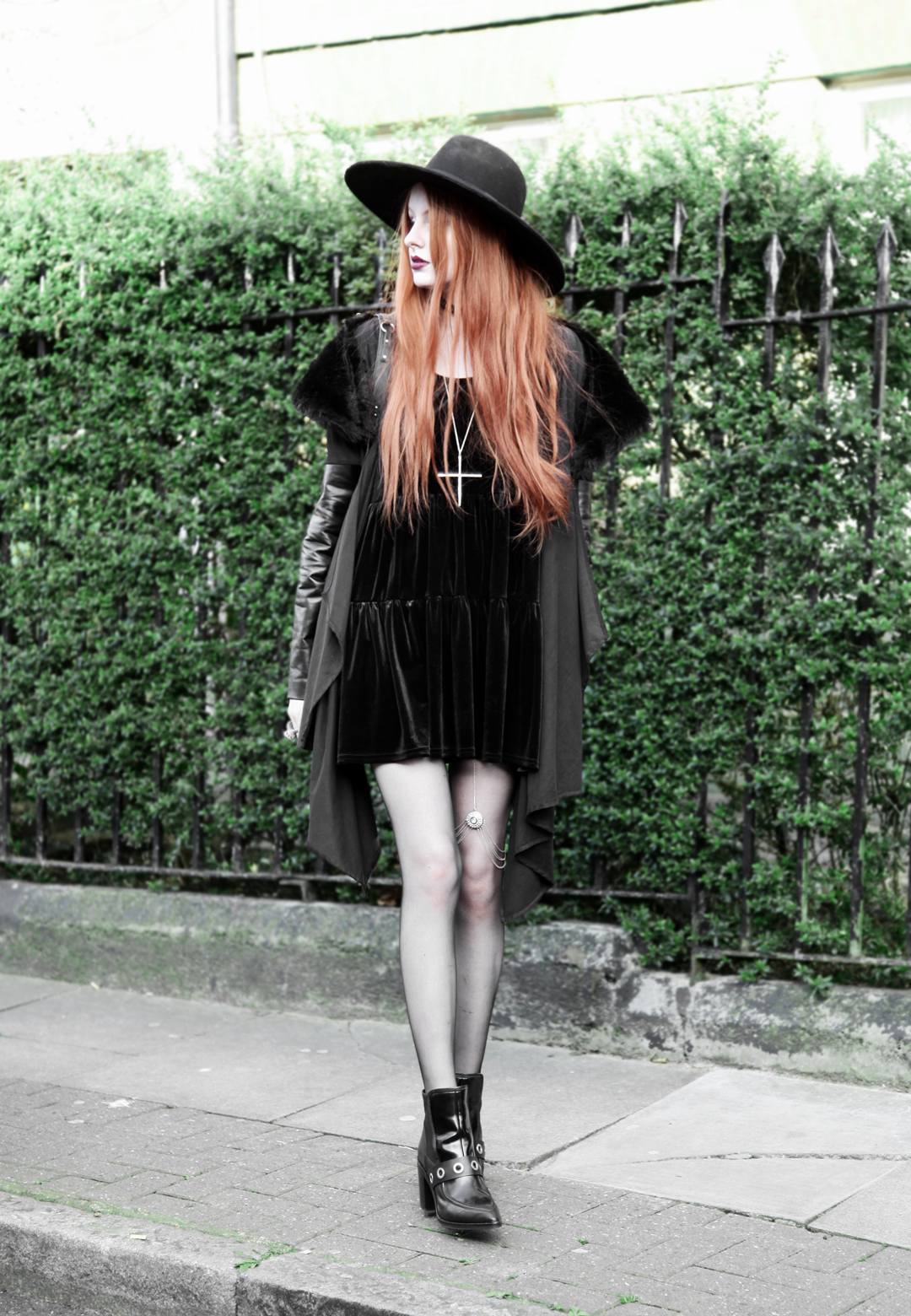 Olivia Emily wears Asos Reclaimed Vintage tiered black velvet dress, Killstar Witch Brim hat, Sanctus Asylum vegan suede coat, River Island leg chain, Asos eyelet boots