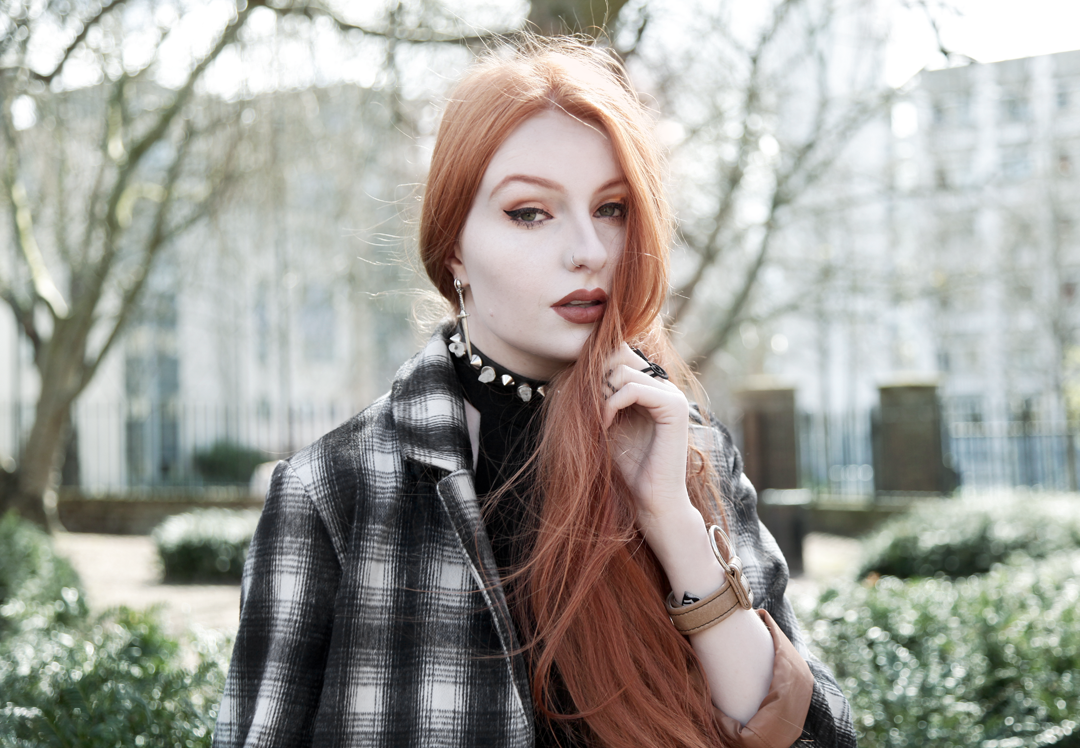 Olivia Emily wears Brave Soul Plaid Overcoat, Asos Black Zip Halter Top, Killstar Spike & Quartz Choker and Fox + Owl Inifinity Cuff in Taupe