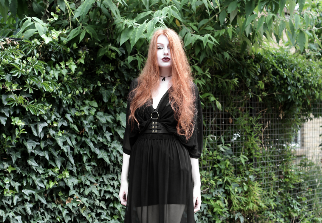 Olivia Emily wears Killstar Mesh Top, Dark Thorn Chastity Sheer Maxi Skirt, Asos Harness and Rogue and Wolf Choker