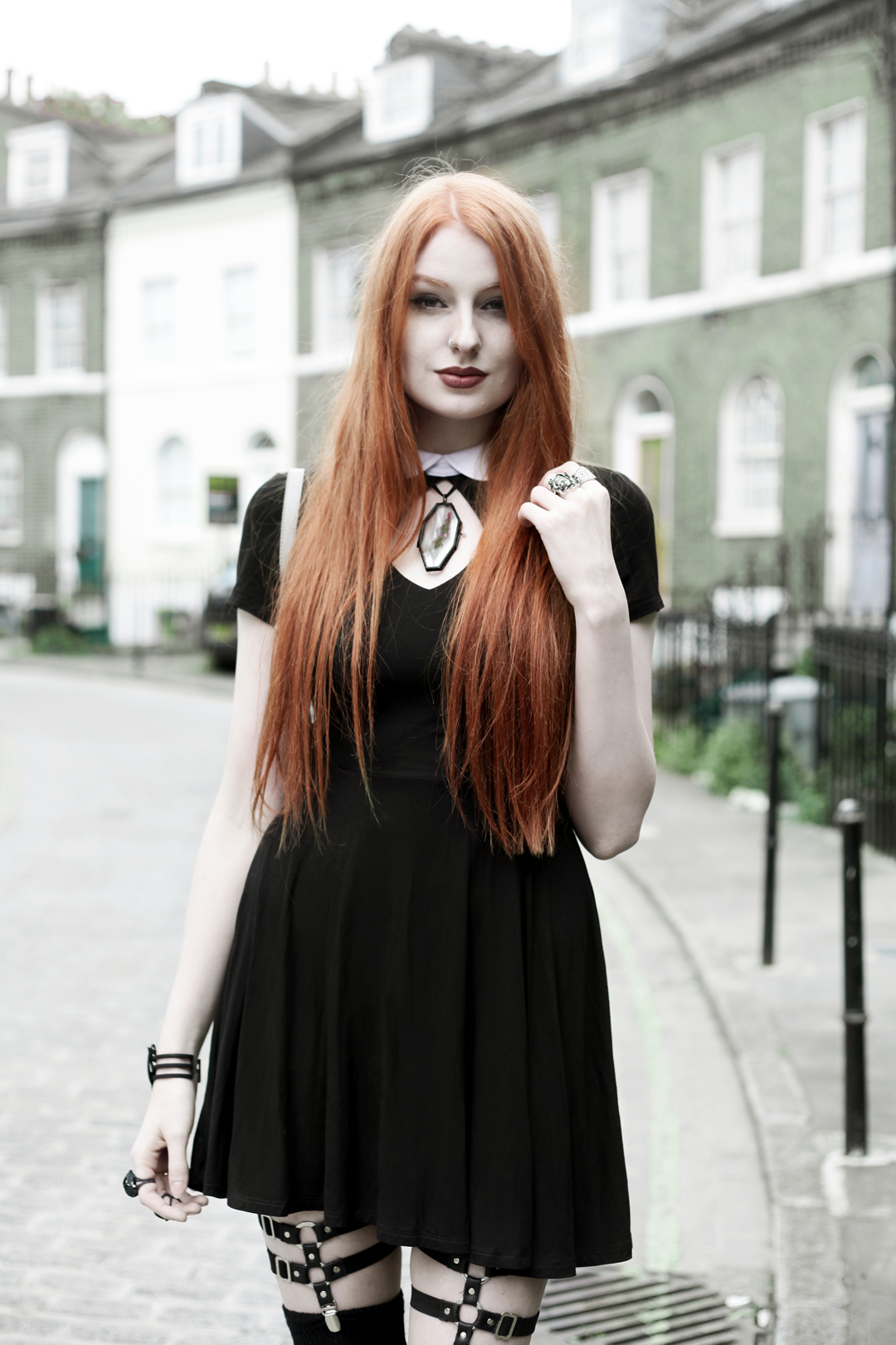 Olivia Emily wears Regalrose Pressed Flower 'Mourner' Choker, Killstar 'Bad Habits' Dress, Jakimac thigh harnesses, Rogue and Wolf Matte Black Bracelet and Asos socks