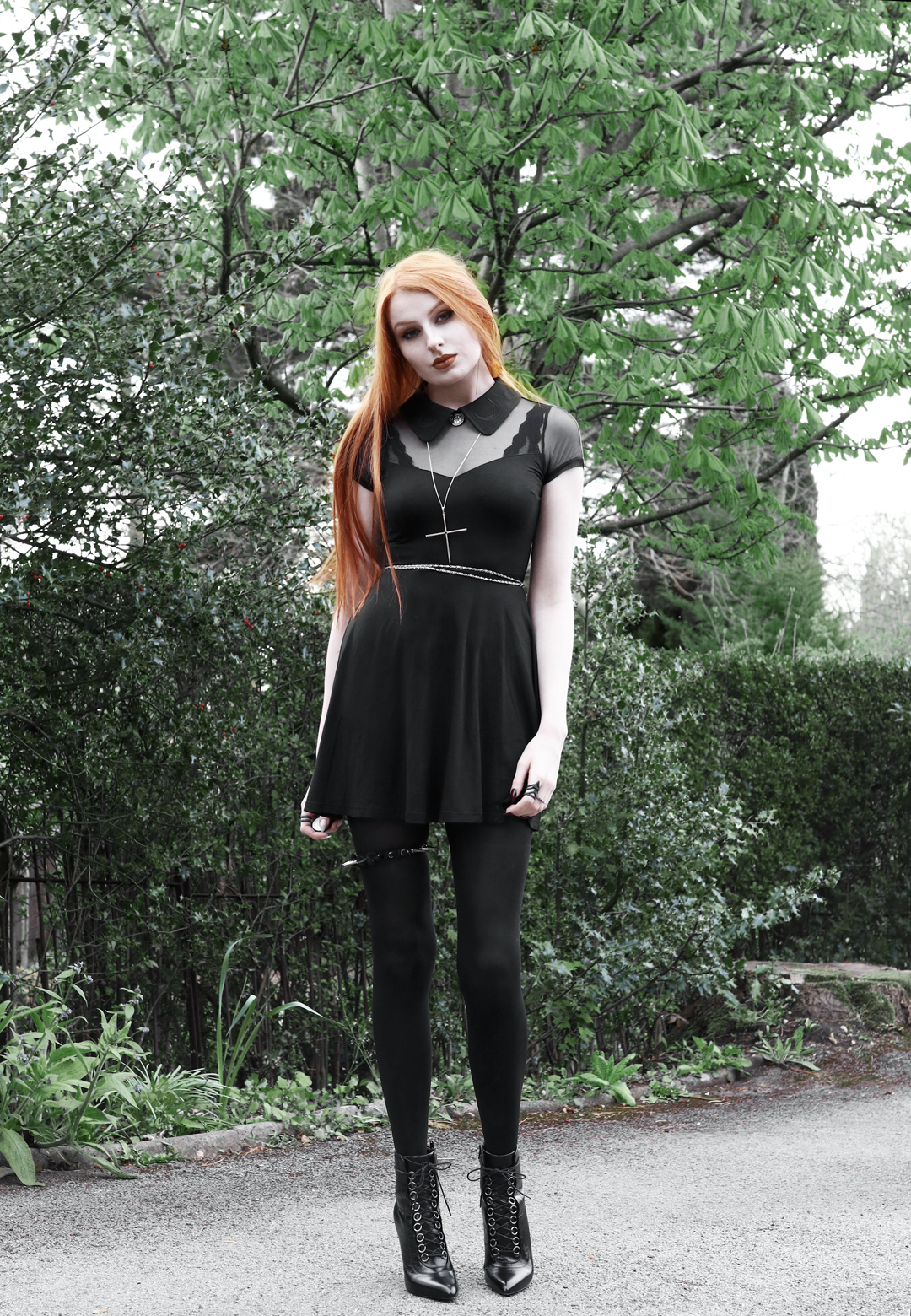 Olivia Emily wears Killstar Dana dress, Kiki Minchin necklace, spiked garter, Saint Laurent Fetish boots YSL SLP