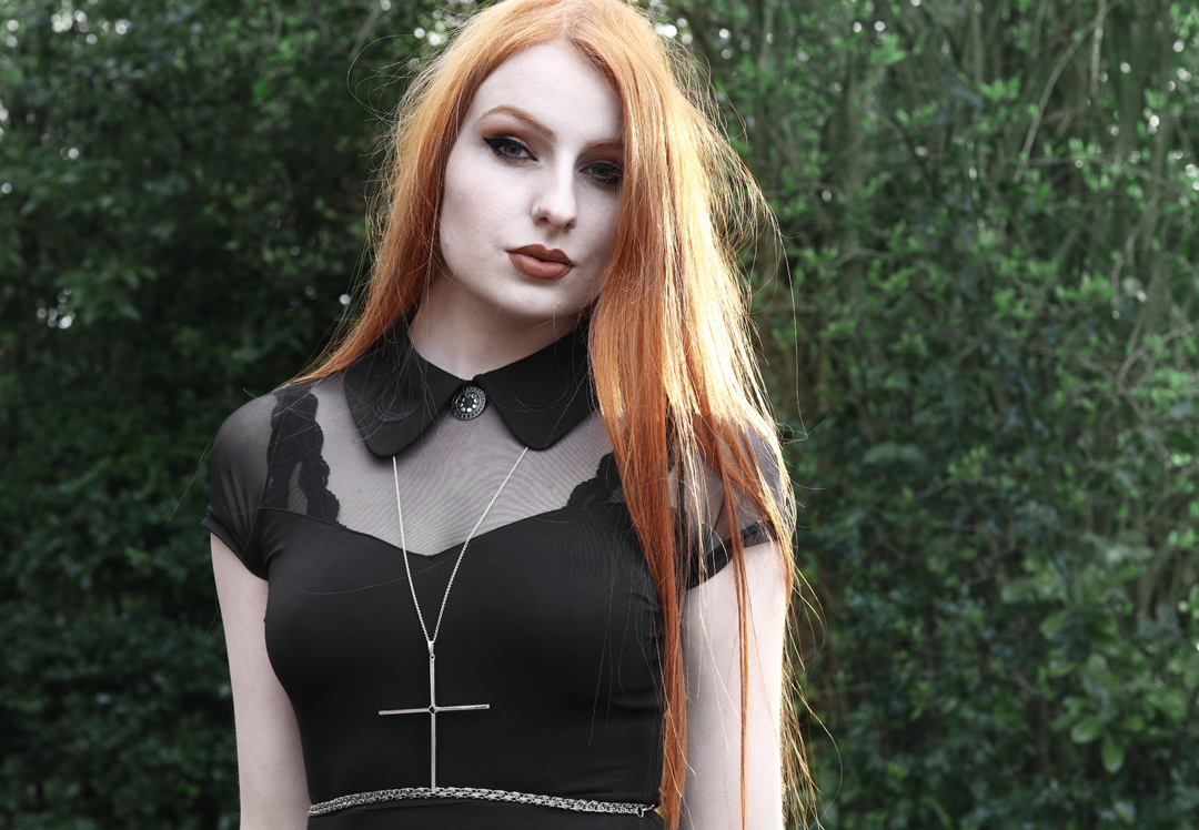 Olivia Emily wears Killstar Dana dress, Nyxturna moon phases pin and Kiki Minchin necklace