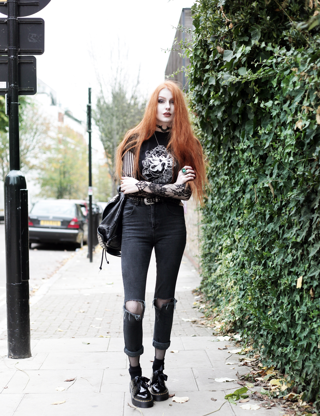 Olivia Emily wears CosQueen Black Mirror Princess Tee, Motel Black Lace Top, Asos Western Belt, Asos High Waisted Ripped Jeans, Dr Martens Patent Holly Shoes