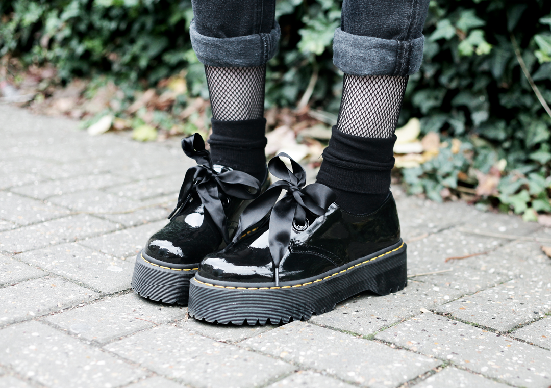 Olivia Emily wears Dr Martens Patent Holly shoes