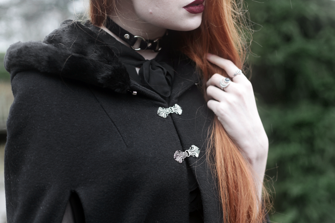 Olivia Emily wears Dark Thorn Clothing Cape, Killstar Nu Decay Dress, and Lime Crime Wicked Velvetine