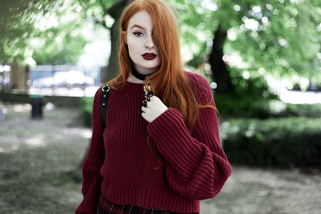 Olivia Emily wears River Island Studio Red Jumper, Killstar Heart Choker, Killstar Emily Heart Choker and Rogue and Wolf Cat Familiar ring