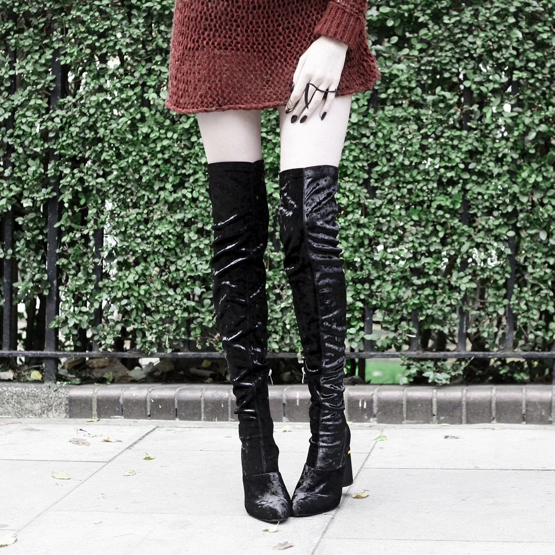 Olivia Emily wears Unif Knit Jumper, Rogue and Wolf Reparer Ring, and Ego Velvet Over Knee Boots