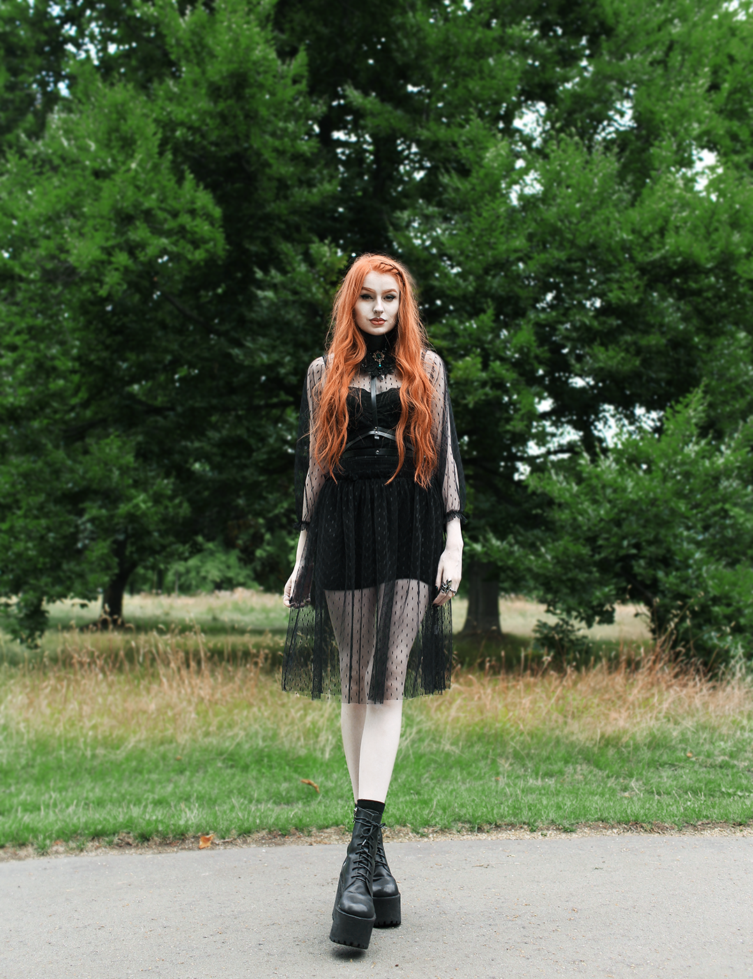 Olivia Emily features a beachy waves hairstyle, styled with Rahua Sea Salt Spray at Haris Hairdressers, and wears Navy London Dress, Pheren Couture Choker, and Unif Boots