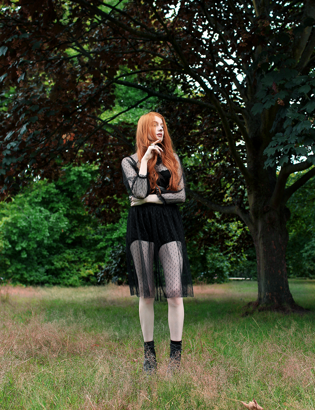 Olivia Emily features a beachy waves hairstyle, styled with Rahua Sea Salt Spray at Haris Hairdressers, and wears Navy London Dress, Pheren Couture Choker, and Unif Boots