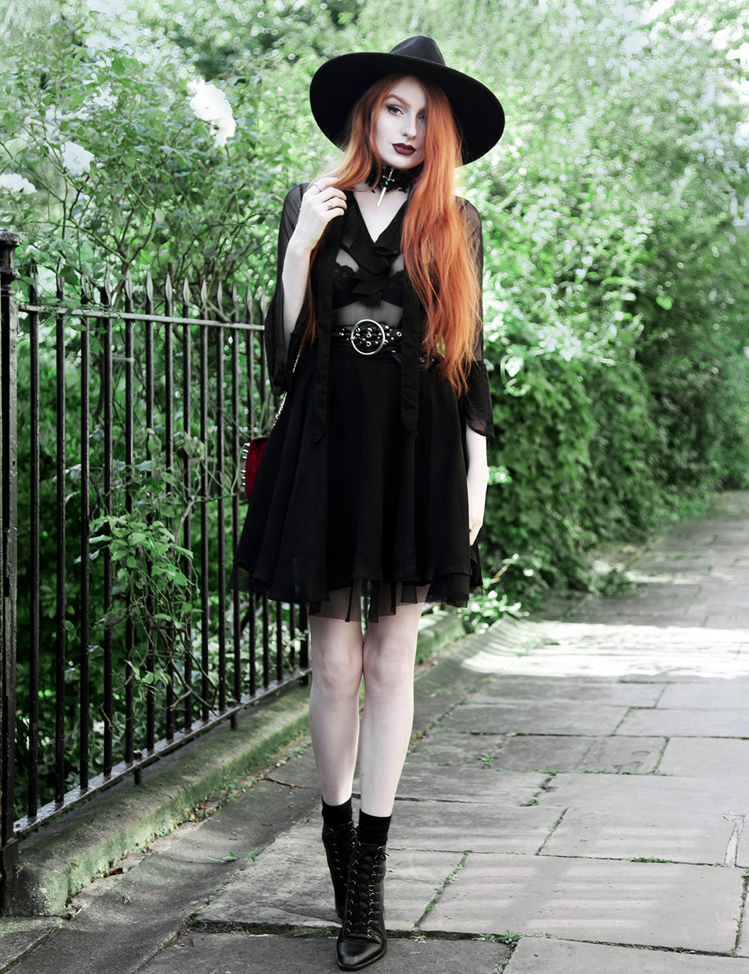 Olivia Emily wears Killstar Witch Brim Hat, Killstar Decay Nu-Mourning dress, Pheren Couture Sword Choker, Asos Eyelet Waist Belt and Asos Pointed Toe Boots