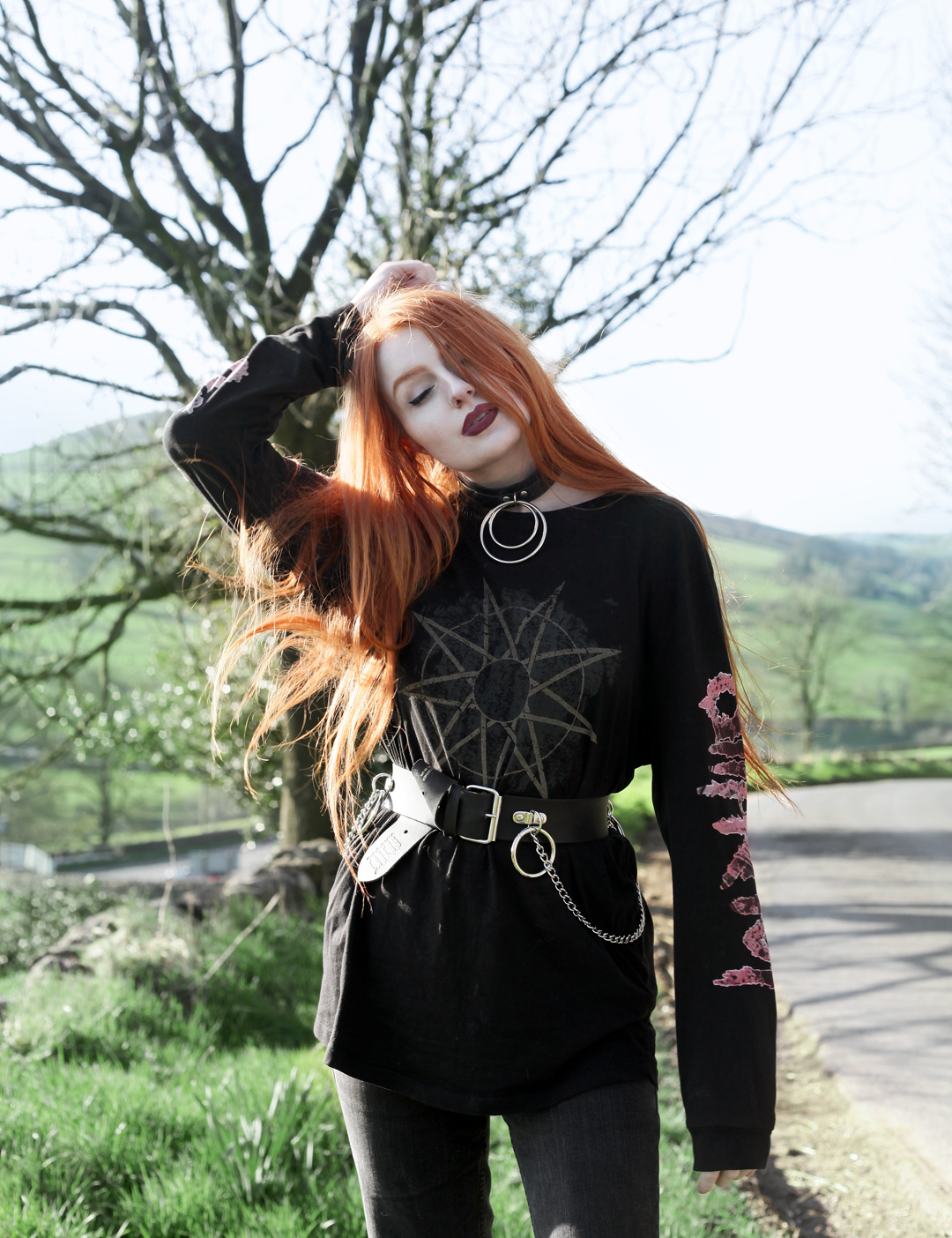 Olivia Emily wears Slipknot Band Tee, Mary Wyatt Chain Belt and Asos ripped straight leg jeans